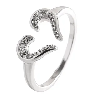 Detailed macro view of adjustable heart ring with sparkling cubic zirconia stones