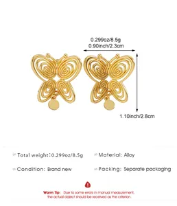 Detail view of golden spiral butterfly stud earrings with size and material specifications