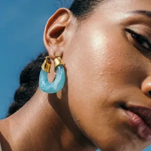 Chunky blue resin hoop earrings with gold-plated stainless steel detail for women