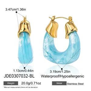 Detailed view of large U-shaped resin and gold-plated stainless steel earrings with measurements