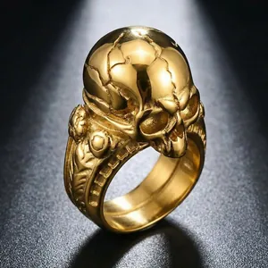 Detailed macro view of a gothic cracked skull ring in gold finish stainless steel