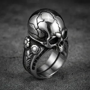 Macro view of dark gothic cracked skull ring crafted from vintage stainless steel