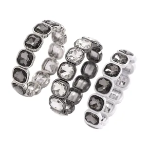 Macro view of three square crystal elastic bracelets in different color variants.