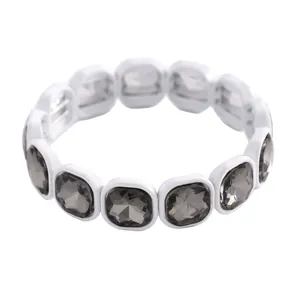 Detailed view of a geometric elastic bracelet featuring faceted smoky grey square crystals