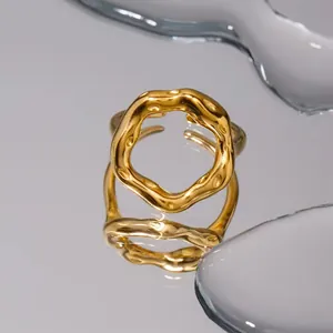 Detailed view of an irregular 18K gold plated stainless steel geometric open ring