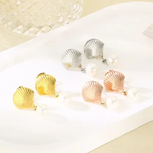 Elegant shell pearl drop earrings set in gold silver and rose gold stainless steel