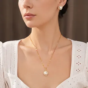 Elegant square pearl necklace and earrings set with zircon accents on a female model