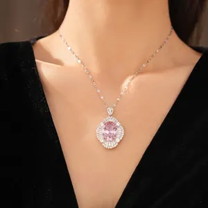Elegant palace-style necklace with oval pink zircon and sparkling halo on a model.