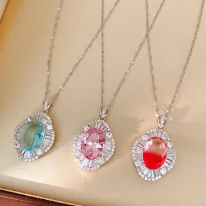 Detail of palace style necklaces with colorful oval zircon pendants in a gift box