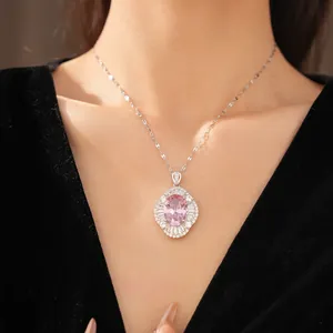 Elegant palace style necklace featuring an oval pink zircon and halo on a silver chain