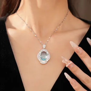 Close-up detail showing the exquisite oval blue zircon and decorative palace style border