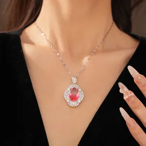 Macro view of a palace-style oval pink zircon necklace worn on a model.