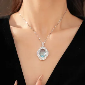 Exquisite close-up detail of palace style oval blue zircon necklace worn on model