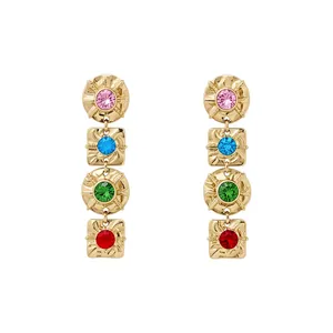 Vintage gold drop earrings featuring colorful rhinestones and ornate geometric patterns