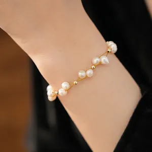 Elegant 18k gold plated freshwater pearl beaded bracelet for women on a model's wrist