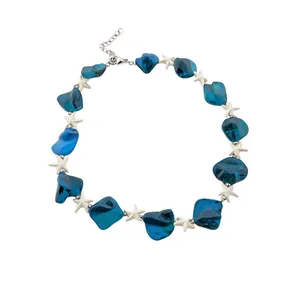 Ocean blue beaded necklace with white starfish charms for a perfect summer vacation style