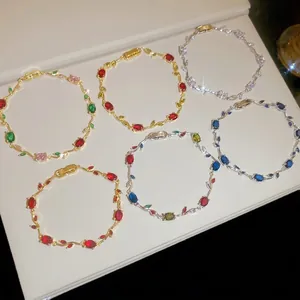 Elegant vine-shaped bracelets with colorful zircon stones in gold and silver plating.