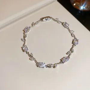 Detailed view of elegant silver vine bracelet with sparkling cubic zirconia stones