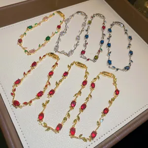 Detailed macro shot showing colorful zircon gemstones on elegant vine-inspired bracelets