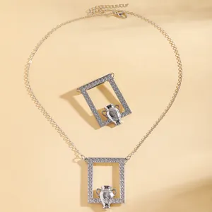 Detailed view of silver amphora pendant and brooch with floral relief patterns