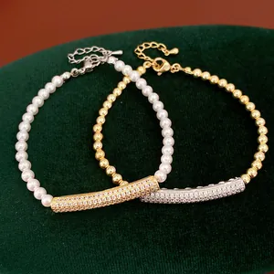Detailed macro view of gold and silver bracelets featuring CZ-set bars and round pearls