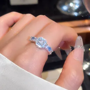 Close-up of a luxury palace style silver ring with square zircon and blue accents