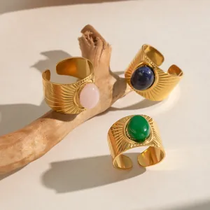 Vintage 18K gold plated textured wide rings set with oval natural stones on wood