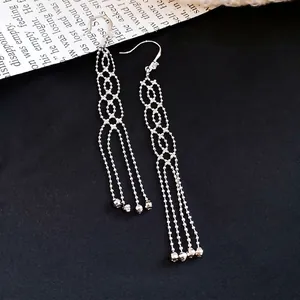 Elegant silver metal tassel earrings with geometric lattice design and zirconia accents
