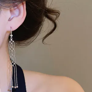 Elegant silver metal tassel earrings with zircon studs and delicate bead chains