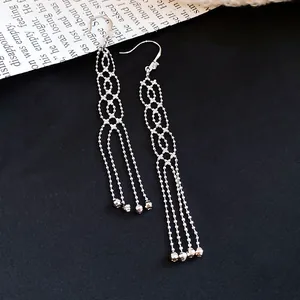 Elegant silver-toned long tassel drop earrings with circular bead chain details.