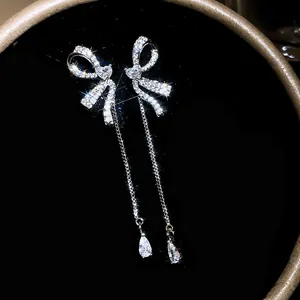 Exquisite sparkling silver bow-knot tassel drop earrings with shimmering zircon stones