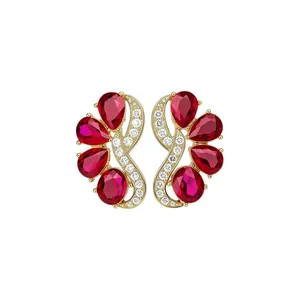 Vintage gold stud earrings with pear-shaped red crystals and sparkling white zircons accents.