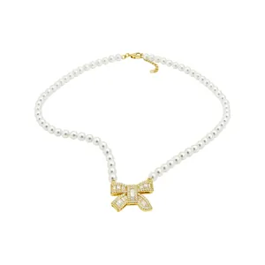 Elegant 18k gold plated bow pendant necklace with lustrous white pearls for women