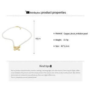 Detailed spec view of 18k gold plated bow pendant pearl necklace with measurements
