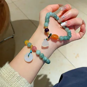 Elegant greenish chalcedony beaded bracelet with jade-like donut and bottle pendants
