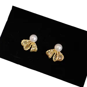 Exquisite 18K gold plated bow knot stud earrings with white pearls and zircons