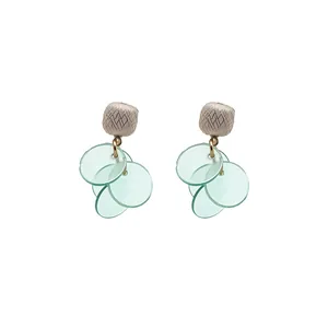 Elegant silver needle earrings with mint green translucent petals and cat eye stone accents.