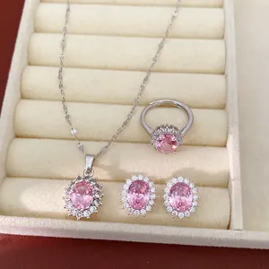 Elegant silver-toned jewelry set featuring oval pink crystals with a sparkling zircon halo design