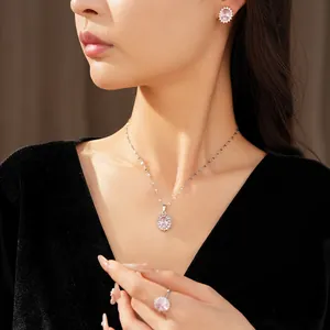 Elegant pink oval zircon jewelry set featuring necklace, earrings and ring on model