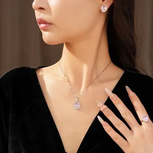 Elegant pink zircon oval jewelry set featuring necklace, earrings, and ring worn by model