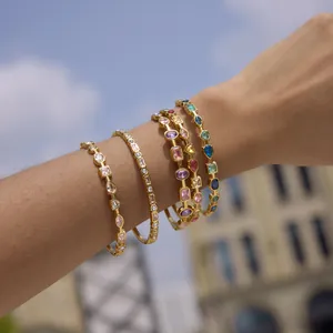 Elegant 18K gold-plated stainless steel bracelets with colorful zircons worn on wrist