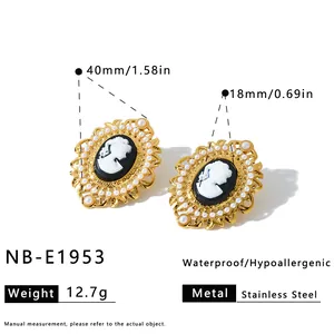 Macro detail of oval cameo earrings with pearls and gold stainless steel frame