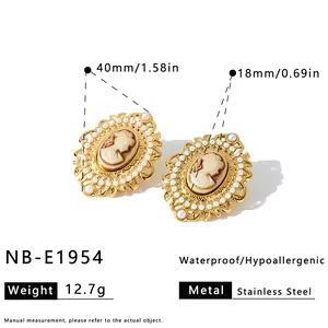 Detail view showing dimensions of vintage cameo earrings with pearls.