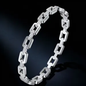 Macro detail of polished stainless steel square link bracelet with small inlaid stones