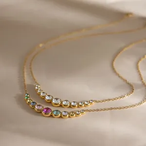 Detailed view of 18K gold plated necklaces featuring multi-color round cubic zirconia stones