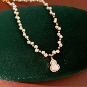 Elegant pearl necklace with 18k gold plated mother of pearl gourd pendant for women