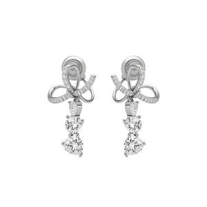 Elegant silver bow and heart drop clip-on earrings featuring sparkling cubic zirconia