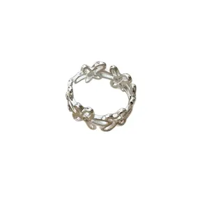 Elegant silver floral hollow open ring with a minimalist design for women.