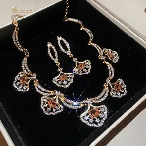 Luxury palace style jewelry set featuring gold fan pendants and sparkling crystals for women