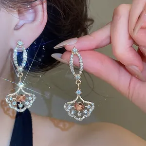 Elegant fan-shaped drop earrings with sparkling rhinestones and vintage palace style